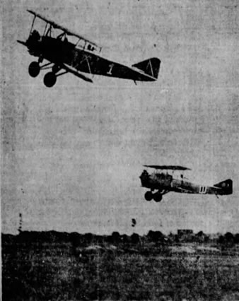 Buhl Airster racers over Long Island—R. E. Hudson (top) and Nick Mamer in trial flight. (The Spokesman-Review)
